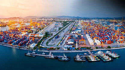 Aerial view of commercial port willed with cargo containers