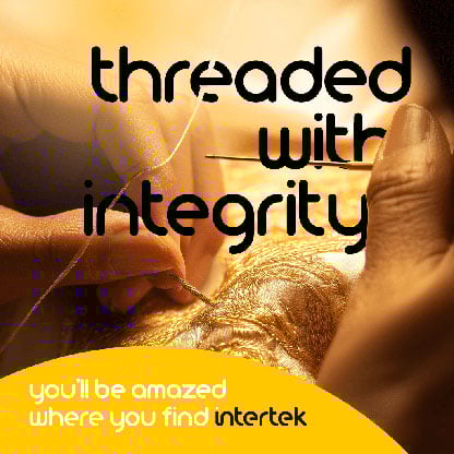 Person sewing with gold thread