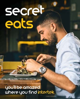 A man enjoying a meal at a restaurant table